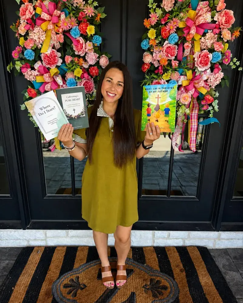MaCarly Zoellick holding her books Cultivating a Pure Heart and Who I Am in the Eyes of My Father